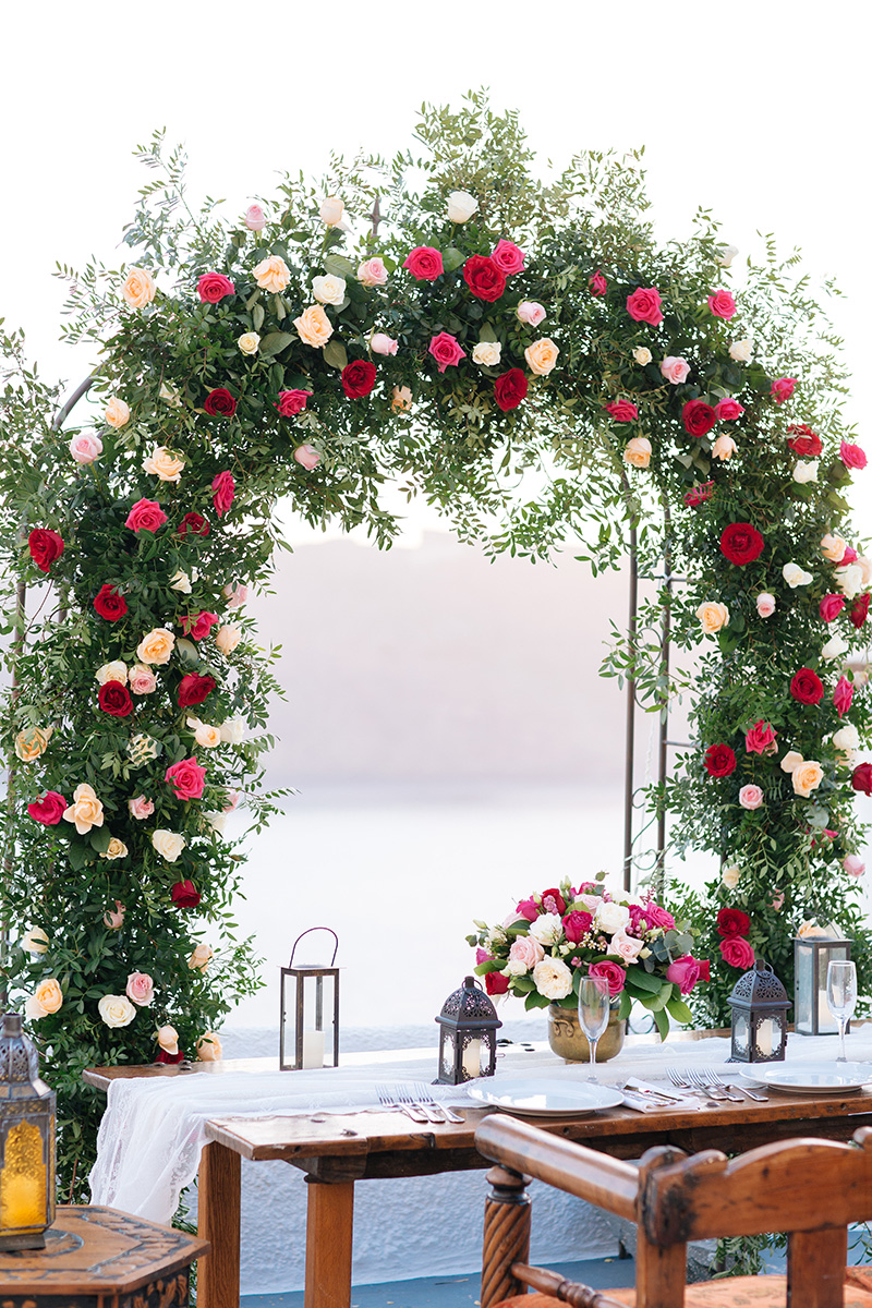 Lush flower arch-Santorini wedding