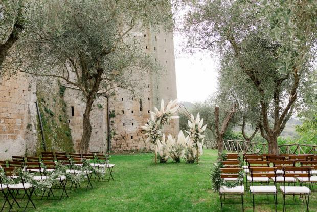Romantic-modern  ceremony with pampas  at an old castle in Italy