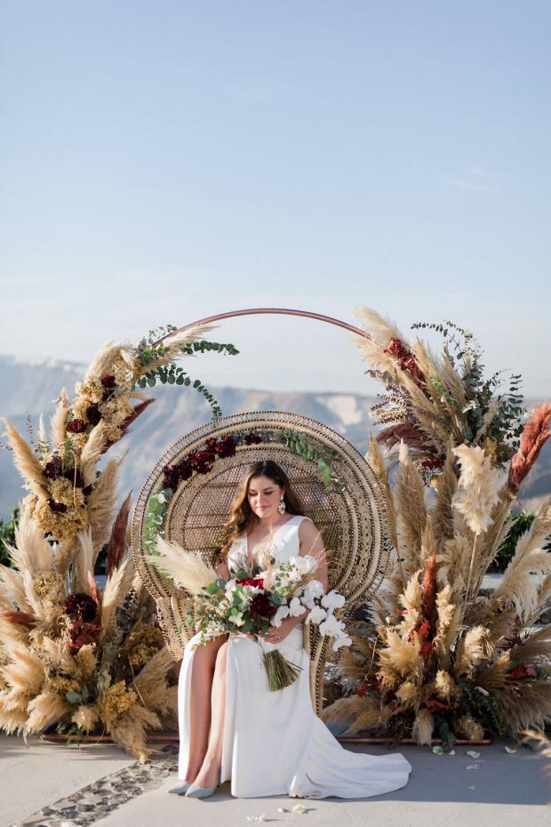 wedding peacock chair and pampas grass