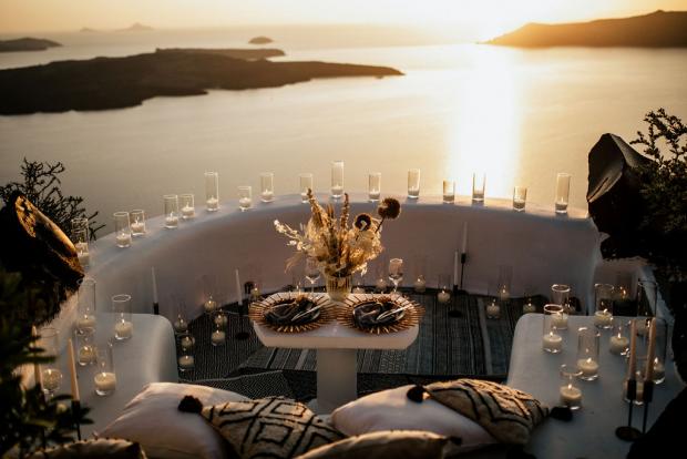 Romantic dinner at a Cycladic balcony in Santorini, Greece