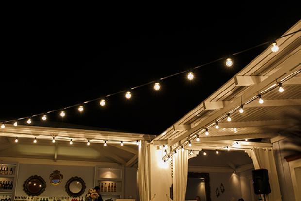 Santorini wedding reception- bistro lights