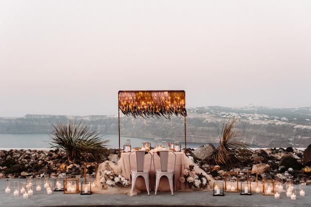 romantic elopement dinner in Santorini- candles and fairy lights