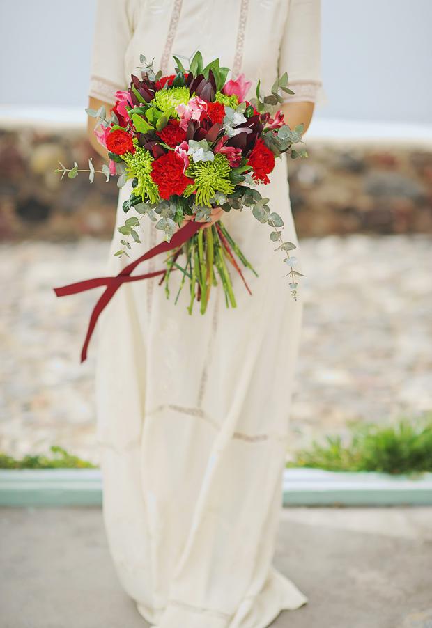Boho wedding in Santorini- wedding bouquet in red and marsala
