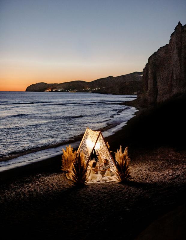 Romantic fairy lights dinner with pampas and shell chandeliers 