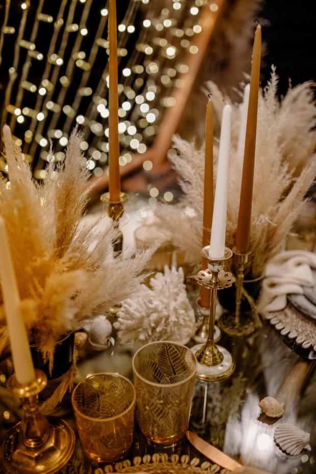 Romantic fairy lights dinner with pampas and shell chandeliers 